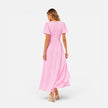 Women's elegant maxi dress by FJØRNA featuring a deep V-neck and puff sleeves, perfect for formal occasions.
