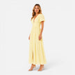 Elegant women's maxi dress by FJØRNA featuring a deep V-neck and puff sleeves, ideal for formal occasions.