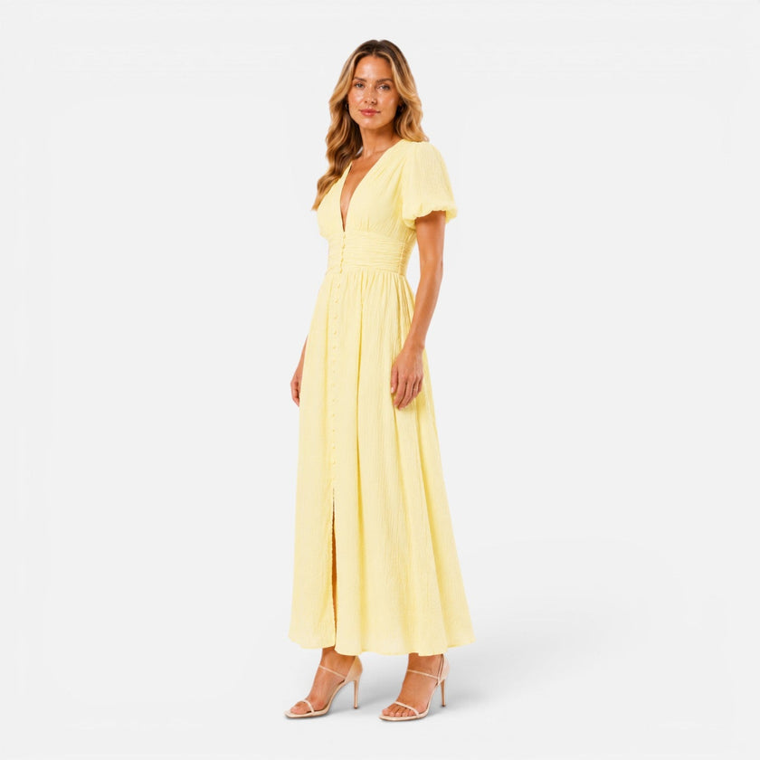 Elegant women's maxi dress by FJØRNA featuring a deep V-neck and puff sleeves, ideal for formal occasions.