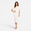 Women's elegant midi sheath dress by FJØRNA featuring tailored fit and pearl split sleeves, showcased on a model.