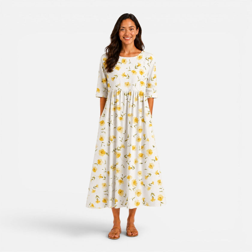 Women's floral midi dress by FJØRNA with a spring and summer design, featuring a lightweight, flowy fabric and vibrant floral pattern.