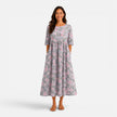 FJØRNA women's floral midi dress for spring and summer, featuring a lightweight, flowy fabric with vibrant floral pattern.