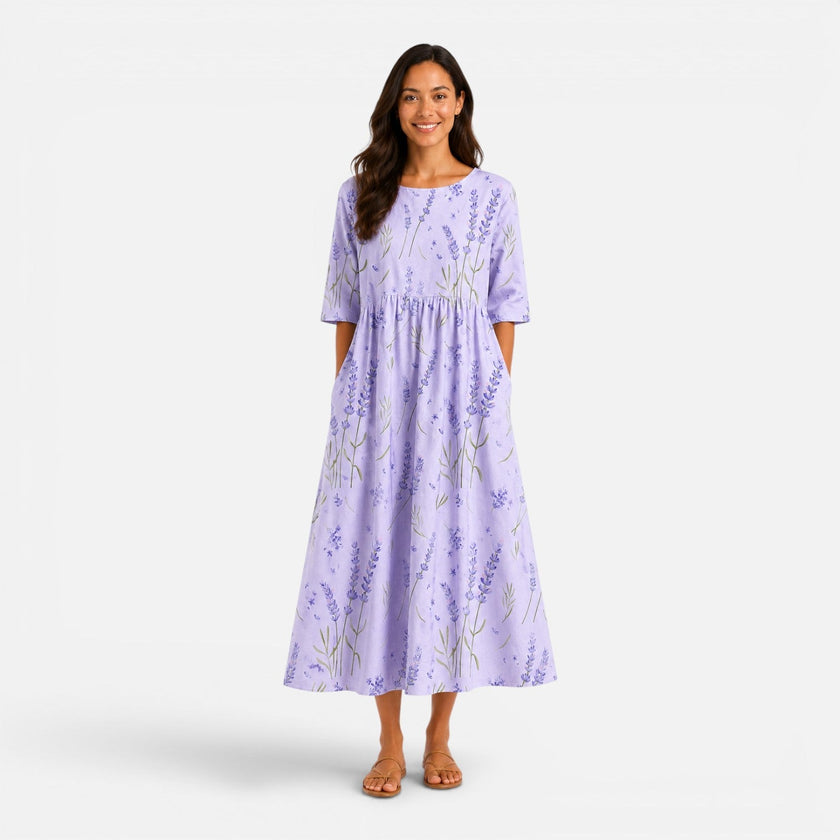 FJØRNA women's floral midi dress with a spring summer floral pattern, flowing fabric, and midi length, perfect for warm weather.