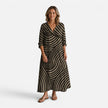 Women's flowy maxi dress with abstract print by FJØRNA, featuring a relaxed fit and stylish design perfect for casual or special occasions.