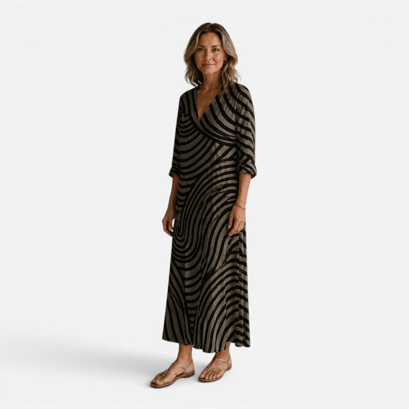 FJØRNA women's flowy maxi dress with abstract print, lightweight fabric, sleeveless design, and relaxed fit for casual wear.