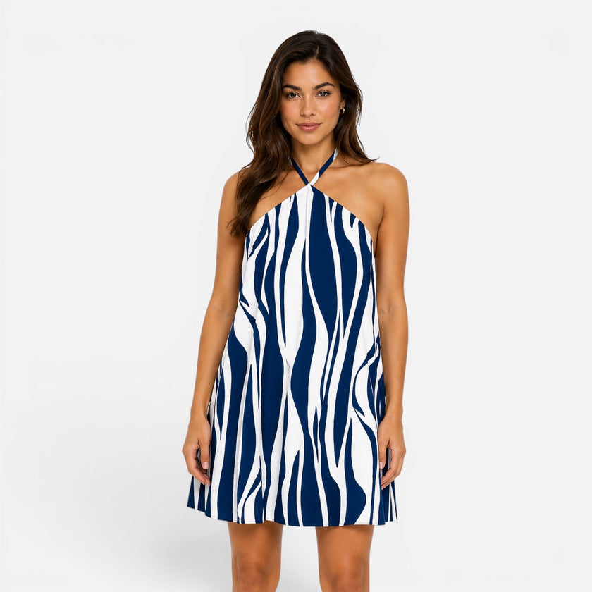 Women's FJØRNA halter mini dress with a flowy summer fit, featuring a stylish neckline and lightweight fabric for warm weather.