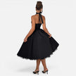 Women's halter neck corset midi dress by FJØRNA, backless fit and flare party dress with elegant design and flowing silhouette.
