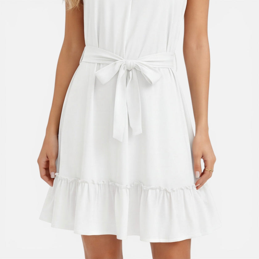 Women's lightweight halter neck summer dress by FJØRNA featuring an elegant mini design and flowing fabric.