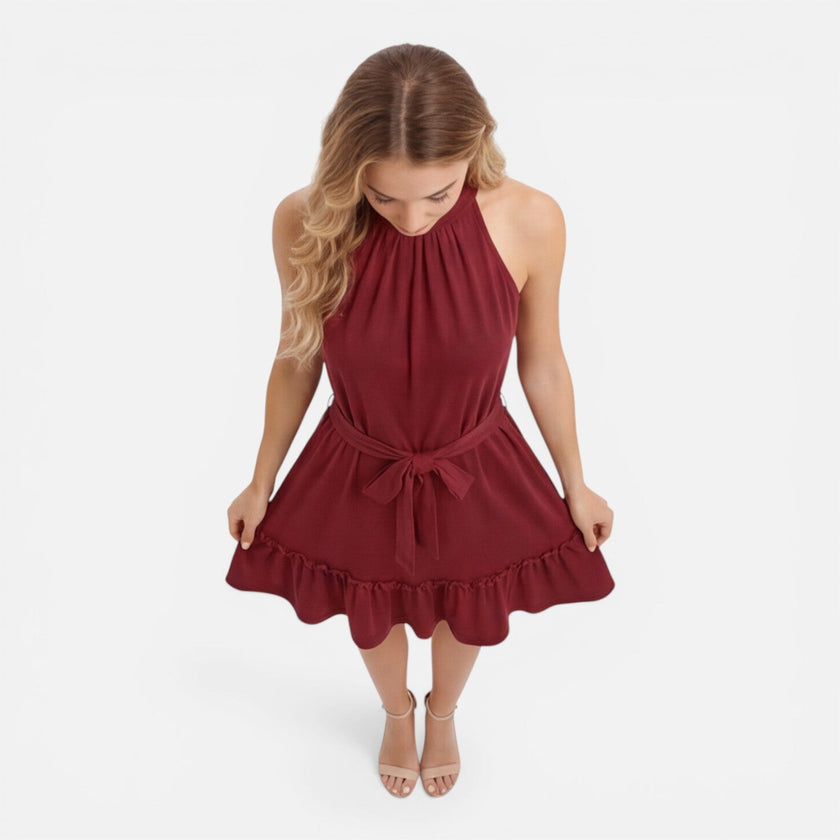 Lightweight women's halter neck summer dress by FJØRNA, featuring an elegant mini style and breathable fabric.
