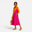 FJØRNA women's midi summer dress with floral pattern, sleeveless design, and flowy fabric, perfect for warm weather.