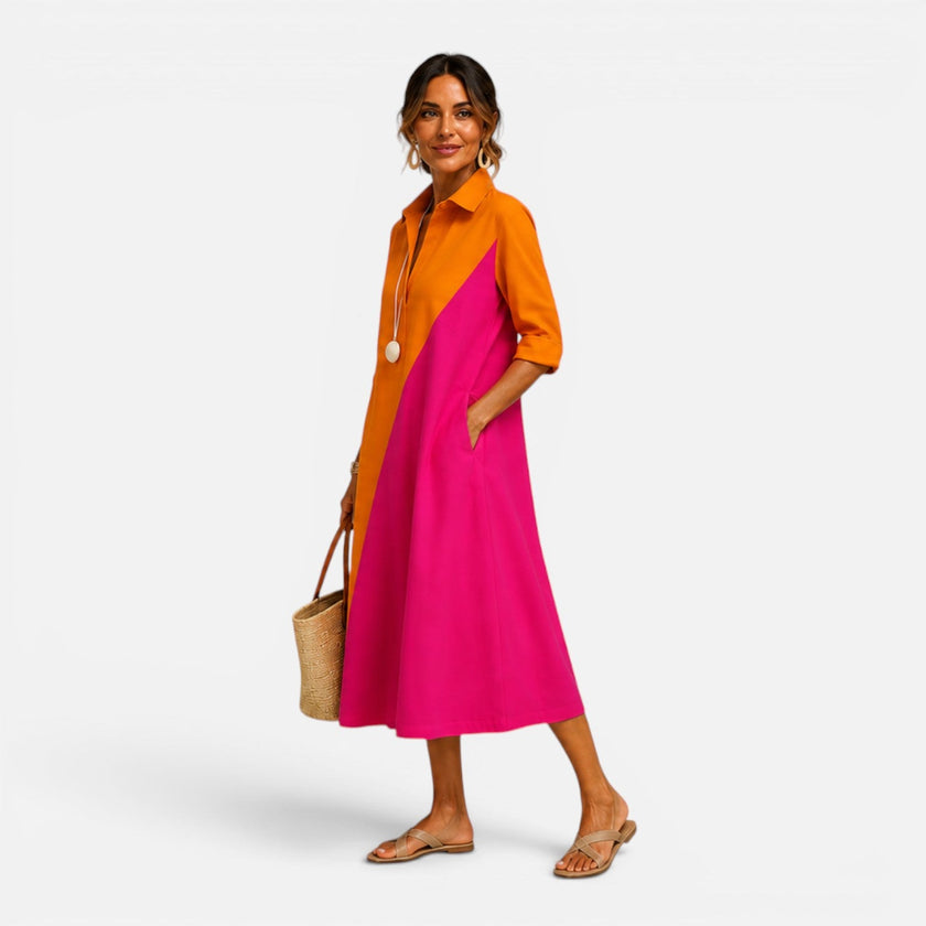 FJØRNA women's midi summer dress with floral pattern, sleeveless design, and flowy fabric, perfect for warm weather.
