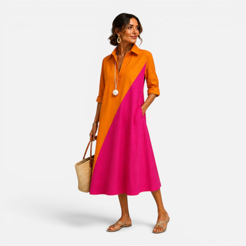 FJØRNA women's midi summer dress with lightweight fabric, sleeveless design, and floral pattern perfect for warm weather.