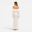 Women's off-shoulder lace maxi dress with flare sleeves by FJØRNA, featuring intricate lace details and flowing silhouette.