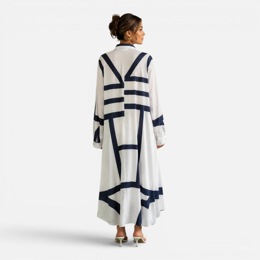 Women's oversized maxi dress by FJØRNA with geometric print, loose fit, elegant design, perfect for casual or dressy occasions.