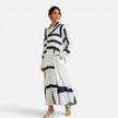 Women's oversized maxi dress by FJØRNA featuring a geometric print and loose fit, styled as a comfortable and elegant dress.
