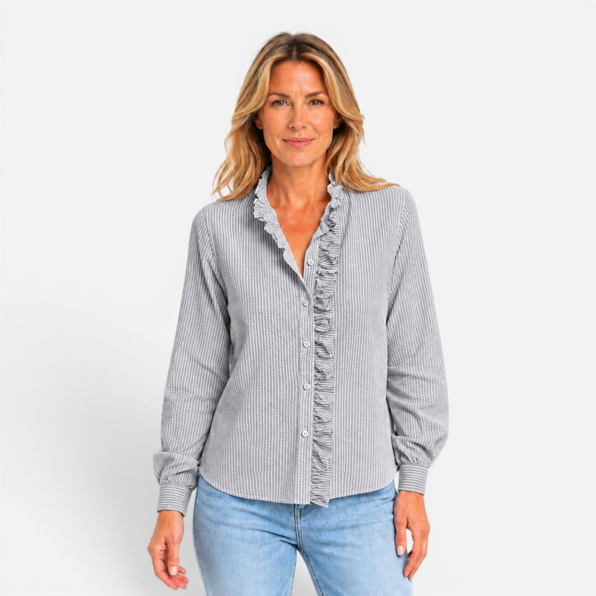 Women's striped long sleeve blouse with ruffle collar and button-up front by FJØRNA, displayed on a mannequin.