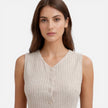 Women's sleeveless striped dress by FJØRNA with button front and slim fit, shown on a model.