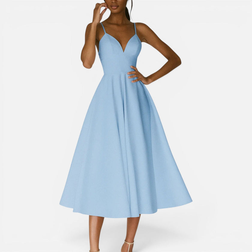 FJØRNA women's wedding guest midi dress with flowing waist cut, elegant design perfect for special occasions.
