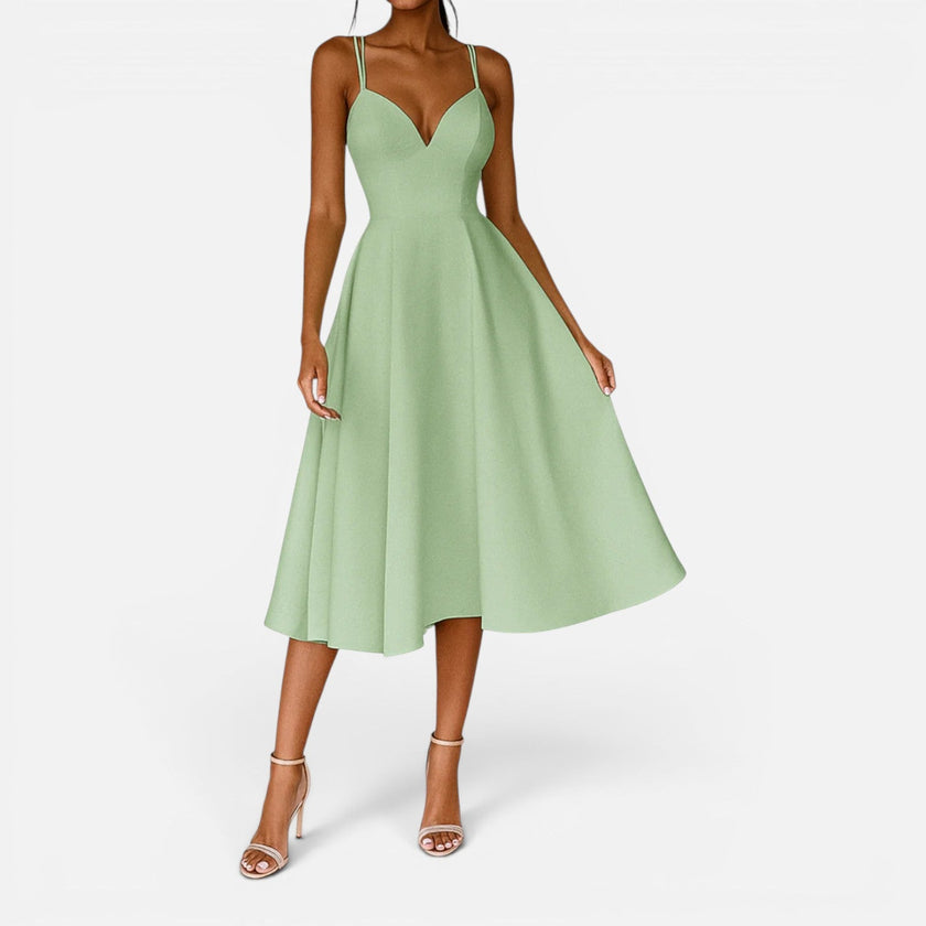 FJØRNA women's wedding guest midi dress with flowing waist cut, elegant and stylish for special occasions.