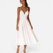 FJØRNA women's wedding guest midi dress featuring a flowing waist-cut design, elegant and suitable for special occasions.