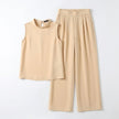 FJØRNA women's elegant two-piece co-ord set with high waist pants and high neck top, flat-lay display in neutral tones