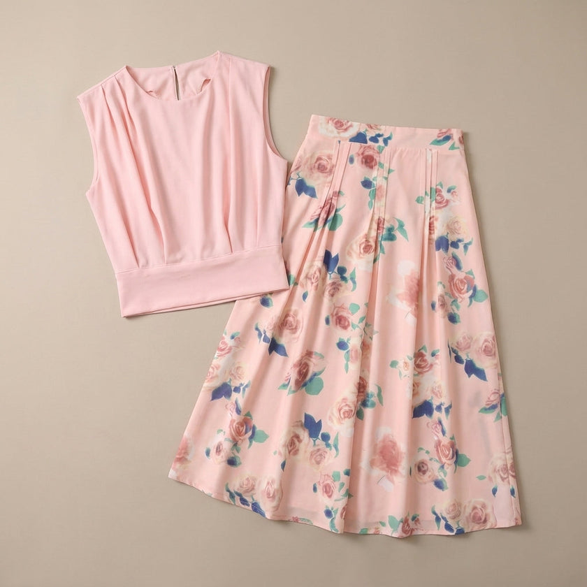 FJØRNA women's summer two-piece pleated co-ord set displayed flat lay, featuring a matching top and skirt in light fabric.