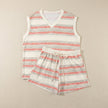 FJØRNA relaxed two-piece set with abstract geometric striped top and drawstring shorts, laid flat.