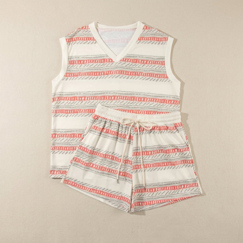FJØRNA relaxed two-piece set with abstract geometric striped top and drawstring shorts, laid flat.