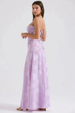 White floral lace-up maxi dress by FJØRNA featuring a flowing silhouette and intricate floral lace details.
