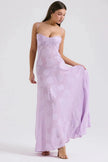 White floral lace-up maxi dress by FJØRNA featuring a flowing silhouette and intricate lace details.