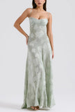 White floral lace-up maxi dress by FJØRNA, featuring a flowing silhouette and intricate lace detailing.