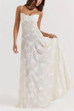 White floral lace-up maxi dress by FJØRNA featuring a flowing silhouette and intricate lace details.