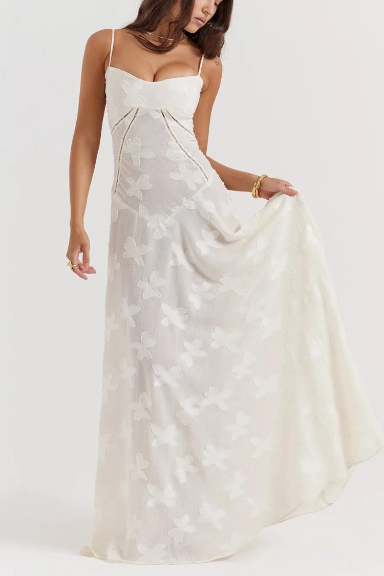 White floral lace-up maxi dress by FJØRNA featuring a flowing silhouette and intricate lace details.
