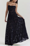 White floral lace-up maxi dress by FJØRNA featuring a flowing silhouette and intricate lace details.