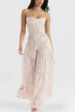 White floral lace-up maxi dress by FJØRNA, featuring a flowing silhouette and intricate lace details.