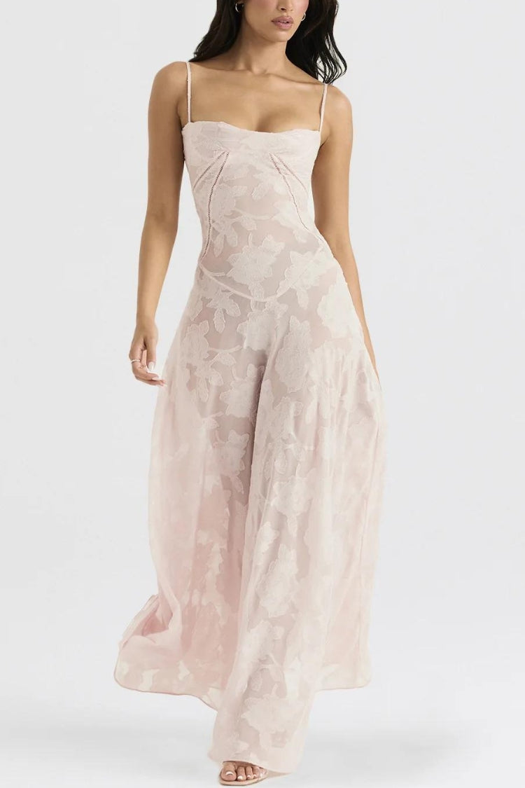 White floral lace-up maxi dress by FJØRNA, featuring a flowing silhouette and intricate lace details.