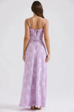 White floral lace-up maxi dress by FJØRNA featuring a flowy silhouette and delicate lace details.