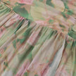 Floral ruched women's maxi dress by FJØRNA featuring a flowy silhouette and vibrant summer floral pattern.