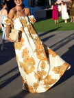 FJØRNA women's floral print sling dress shown in a mini length with colorful flower patterns on lightweight fabric.
