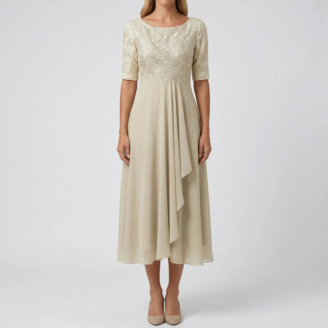White FJØRNA A-line midi dress with lace bodice and flattering silhouette, perfect for elegant occasions.