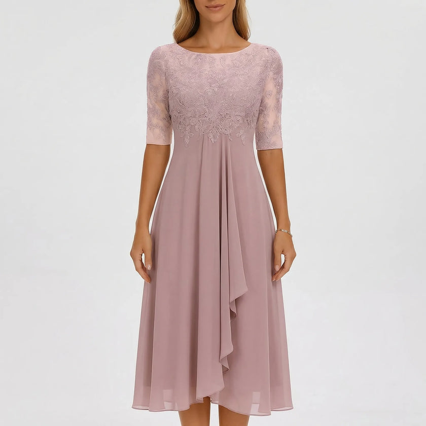 White FJØRNA A-line midi dress with lace bodice, elegant and flowy, perfect for formal occasions or summer events.