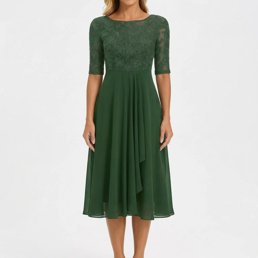White A-line midi dress by FJØRNA featuring a lace bodice and flowing skirt, perfect for elegant occasions.