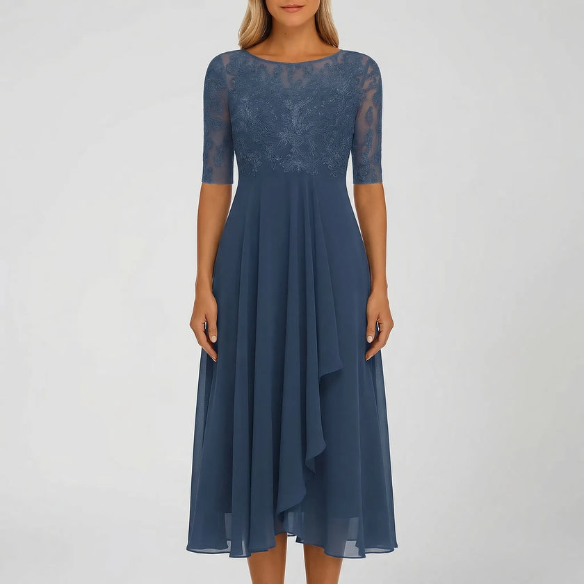 White FJØRNA A-line midi dress with lace bodice, featuring a flowing skirt and elegant design for stylish occasions.
