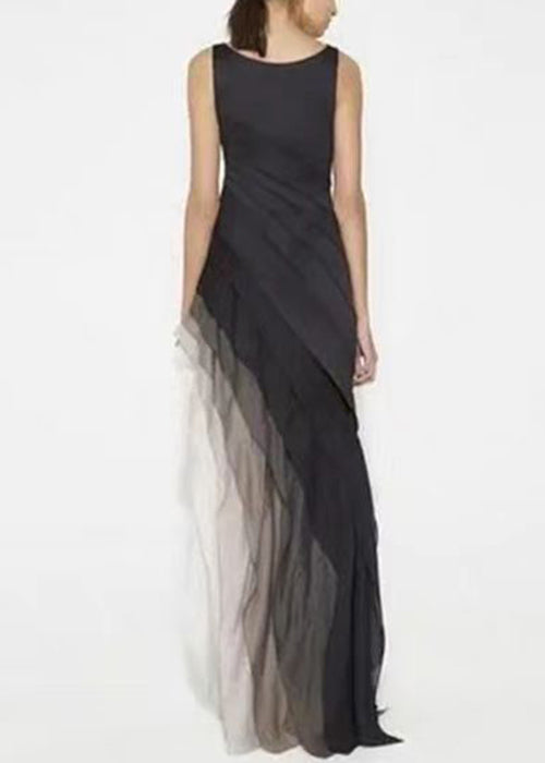 FJØRNA French black high waist patchwork tulle maxi dress, sleeveless with flowing fabric and intricate patchwork design.