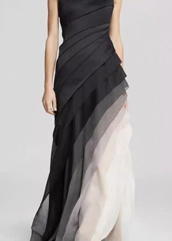 FJØRNA French black high waist patchwork tulle maxi dress, sleeveless, elegant flowy design with layered tulle fabric.