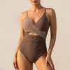 FJØRNA women's summer one-piece swimsuit with V-neck wrap design, shown from the front in a stylish swimwear photo.
