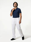 Men's linen trousers by FJØRNA, relaxed fit summer pants, full-body view showcasing breathable, lightweight fabric and casual style.