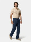 Men's linen trousers from FJØRNA, relaxed fit, breathable summer pants shown in full body view with casual style.