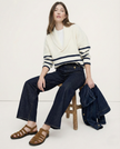 FJØRNA women's wide-leg cotton jeans with high waist, showing relaxed fit and classic denim style on a neutral background.
