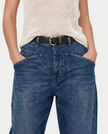 FJØRNA women's denim jeans with a barrel leg style, showcasing classic blue denim and relaxed fit.
